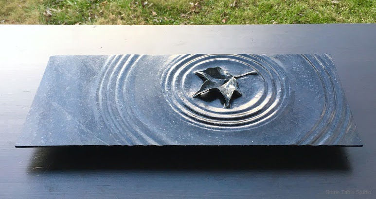Maple leaf sculpture finished in sunlight