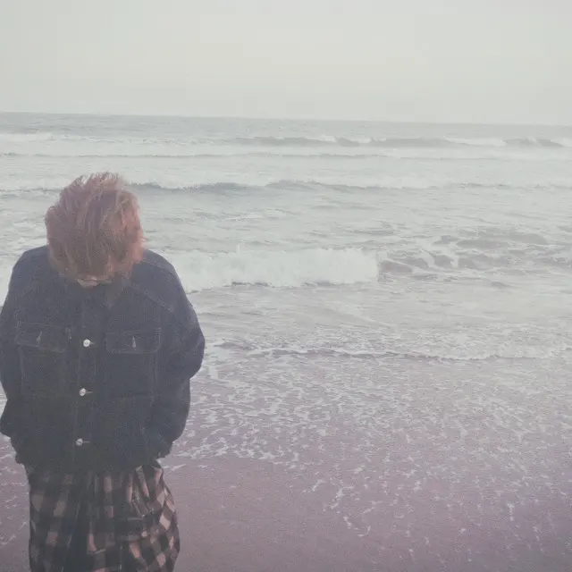 Artist profile image from hahuyen’s submitted Spotify profile, showing a person beside the sea
